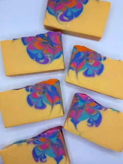 6 yellow soap bars with artistic patterns in corners