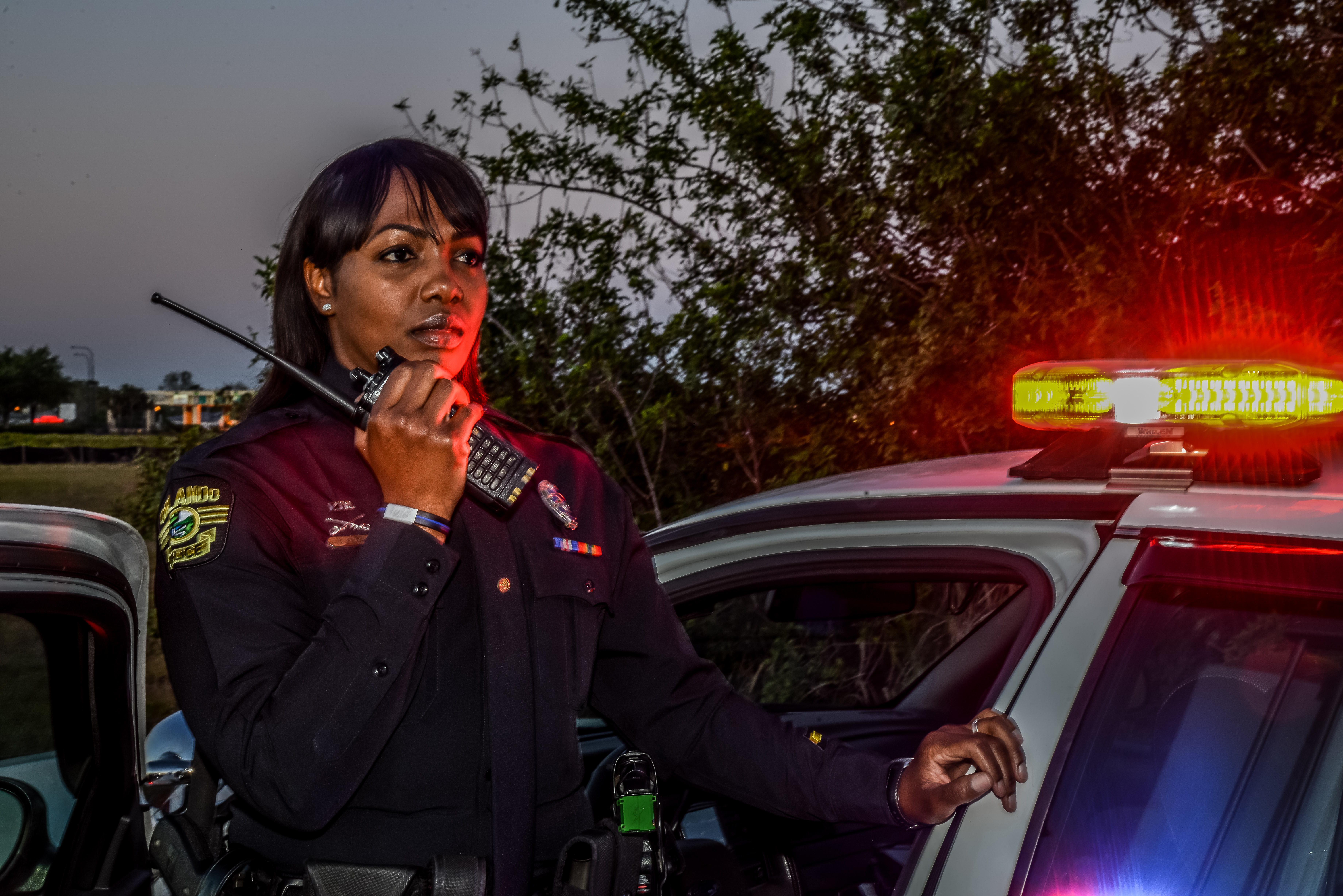Police officer talking into two way radio