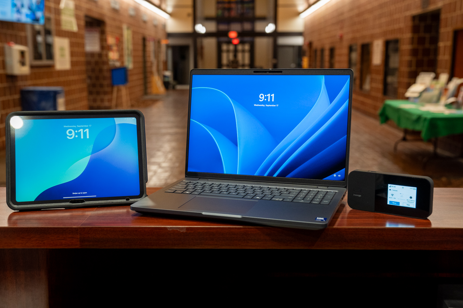 A man and a woman looking at a computer.