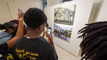 City residents viewing artwork and taking photos.